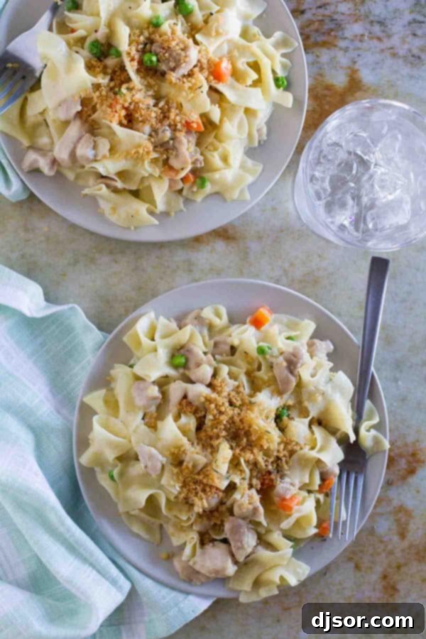 A hearty and comforting Chicken Pot Pie Ragu, featuring creamy chicken gravy and tender pasta, served in a bowl.