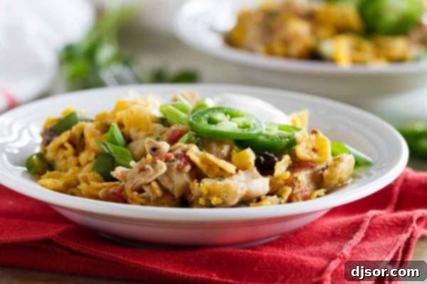 Look no further for an easy slow cooker dinner recipe! This Slow Cooker Cheesy Chicken and Frito Casserole comes together quickly and you can never go wrong when there are Fritos involved!