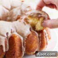 Homemade Monkey Bread 3 pulling a piece of dough from monkey bread