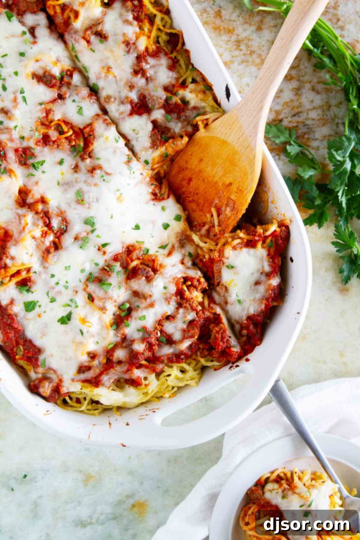 Spaghetti Lasagna 5 A freshly baked Spaghetti Lasagna in a casserole dish, topped with melted, bubbly mozzarella cheese, ready to be served.