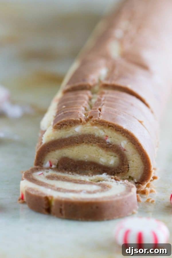 Candy Cane Chocolate Swirl Cookies 5 With spirals of chocolate and peppermint dough, these “Kiss Me” Chocolate Peppermint Pinwheel Cookies are fun and minty and the perfect ending to a date night at home.