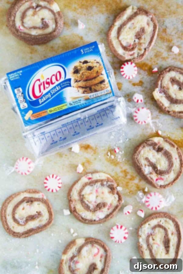Candy Cane Chocolate Swirl Cookies 6 With spirals of chocolate and peppermint dough, these “Kiss Me” Chocolate Peppermint Pinwheel Cookies are fun and minty and the perfect ending to a date night at home.