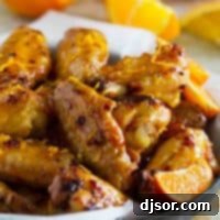 Chipotle Orange Chicken Wings with orange zest sprinkled on top.