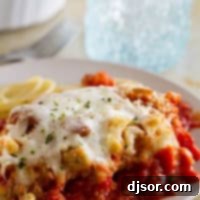 Chicken Parmesan Casserole - an easier version of chicken parmesan, served over spaghetti noodles.