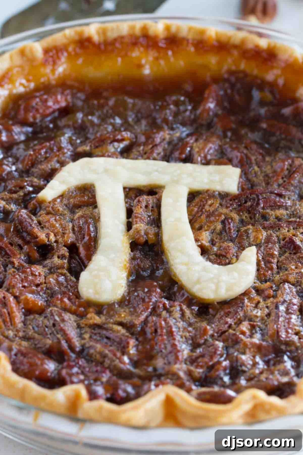 A freshly baked Classic Pecan Pie, cooling on a wire rack, ready to be enjoyed.