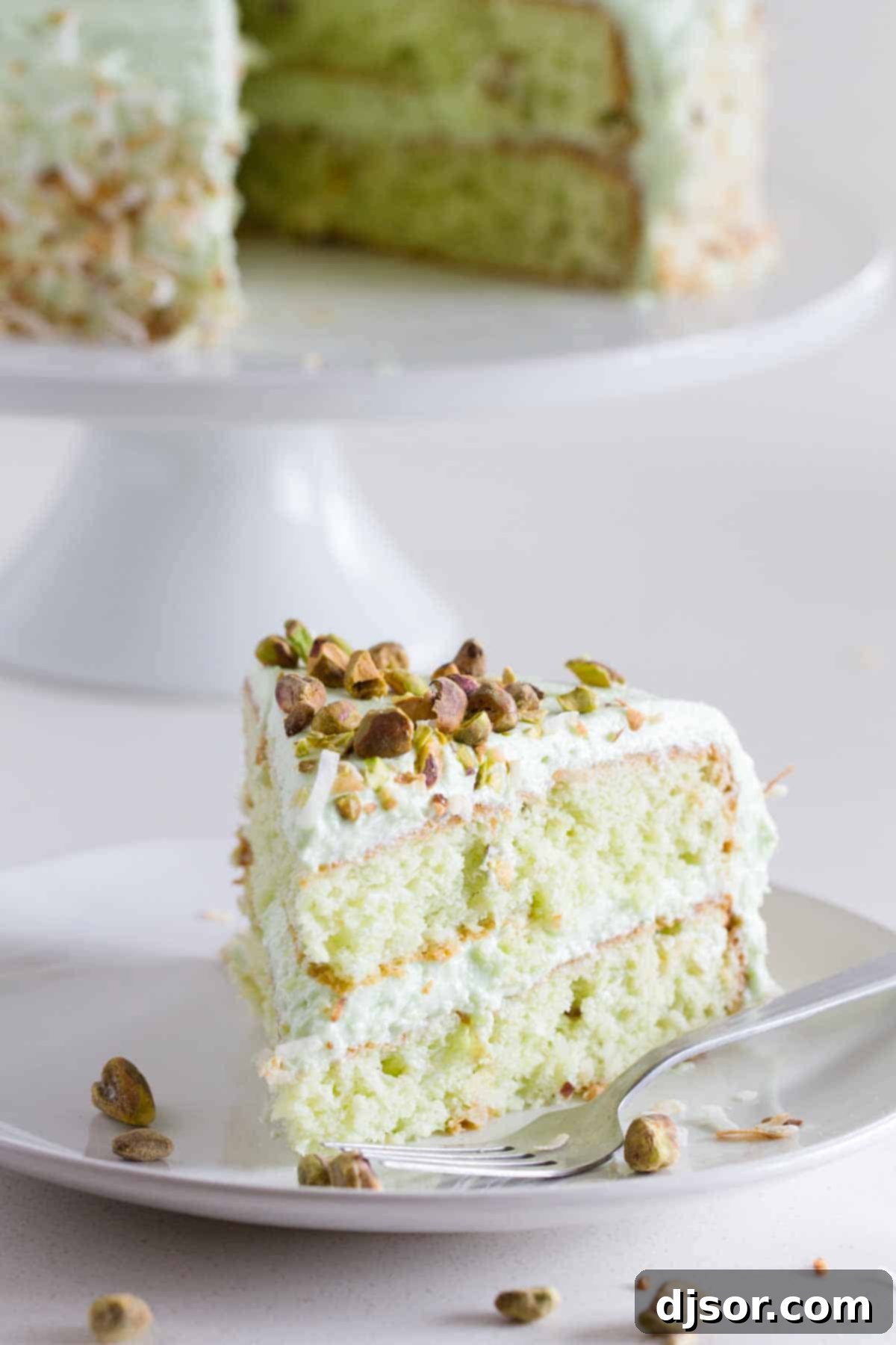 Slice of Pistachio Pudding Cake on a plate.