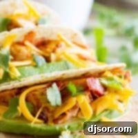 Stacked Chicken Bacon Avocado Tacos 8 Chicken Bacon Avocado Tacos on a cutting board, ready to serve.