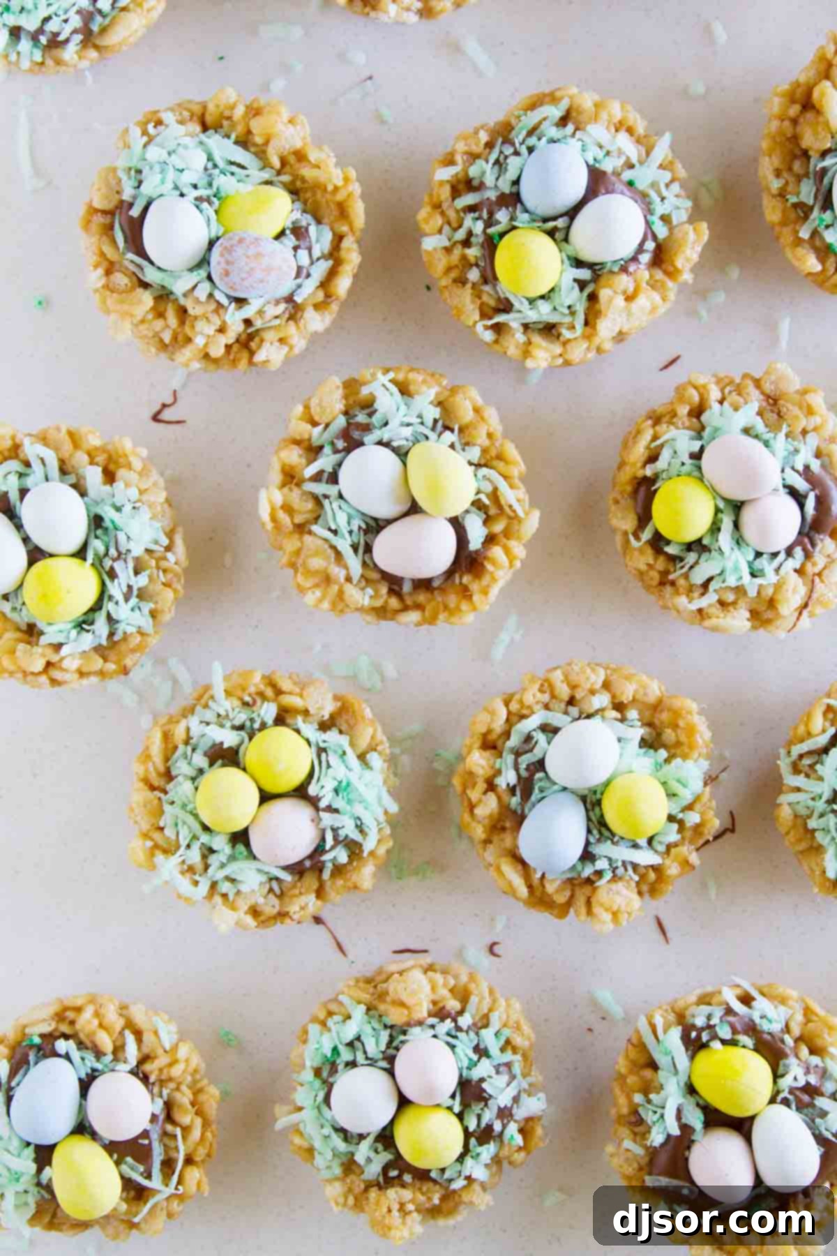 A cluster of beautifully decorated Easter Basket Scotcheroos, each topped with chocolate and colorful Easter eggs, arranged for a festive display.