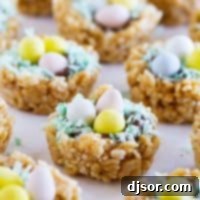 Easter Basket Scotcheroos with chocolate, coconut, and chocolate eggs.