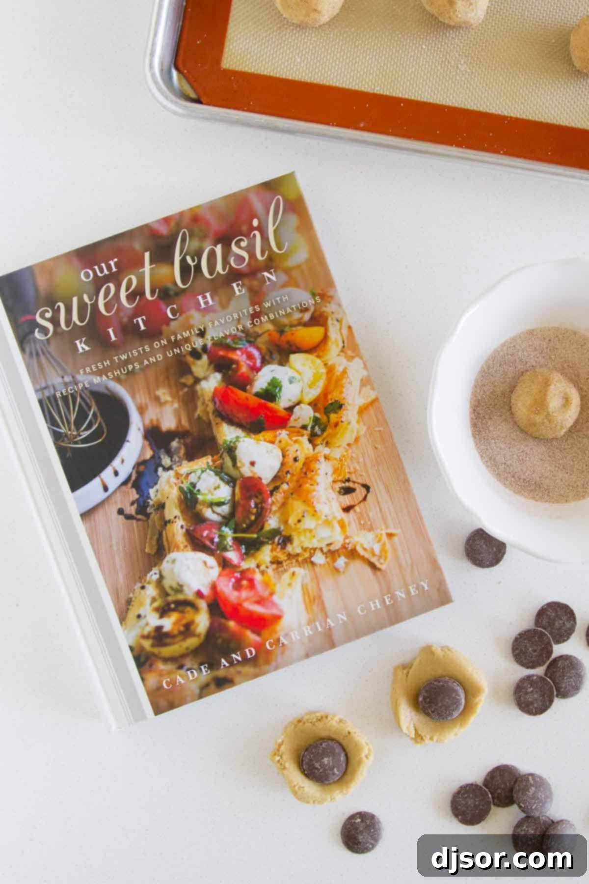 Peanut Butter Cinnamon Cloud Cookies 3 Our Sweet Basil Kitchen cookbook beautifully arranged with fresh ingredients like herbs and vegetables.