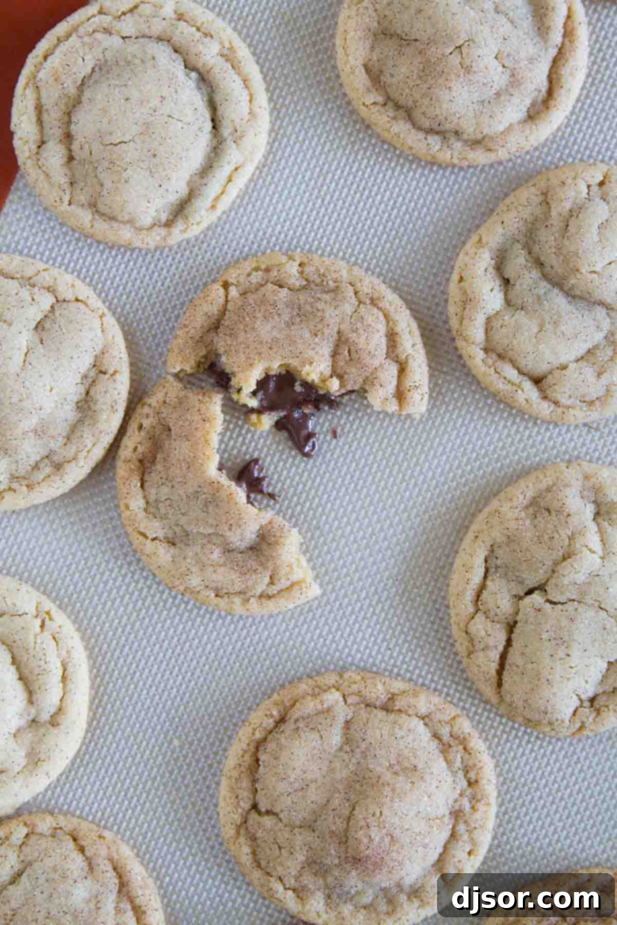 Peanut Butter Cinnamon Cloud Cookies 6 Peanut Butter Cinnamon Meltaway Cookie broken in half, revealing a perfectly melted chocolate center.