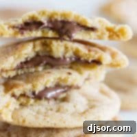 Peanut Butter Cinnamon Cloud Cookies 7 Peanut Butter Cinnamon Meltaway Cookies stacked on top of each other.
