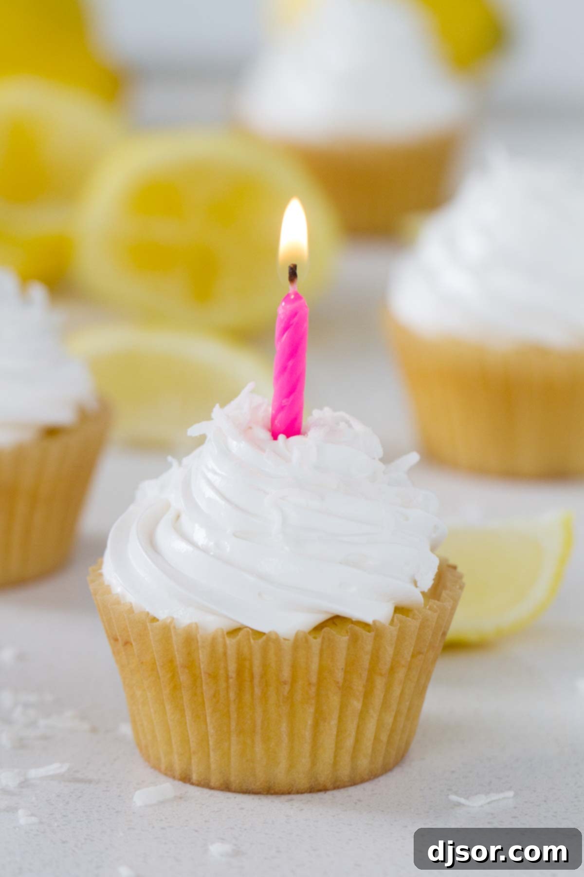 Lemon Sunshine Cupcake with a candle in it.