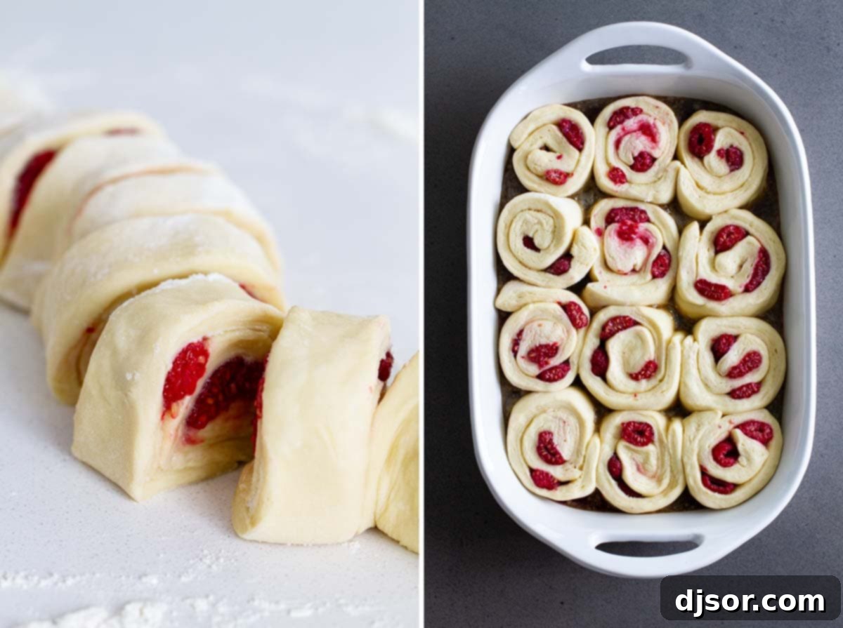 Freshly cut raspberry caramel sticky buns arranged in a baking dish, waiting for their final rise before baking.