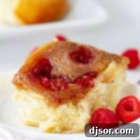 Raspberry Caramel Sticky Bun with fresh raspberries on top.