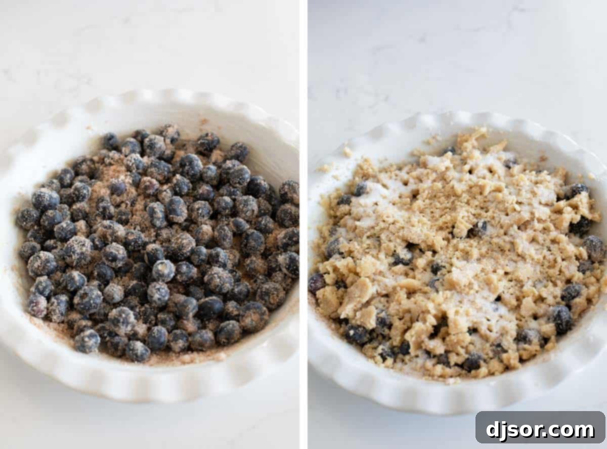 Assembling a fresh blueberry crisp in a pie plate, with the fruit filling topped with the crumbly crisp mixture.