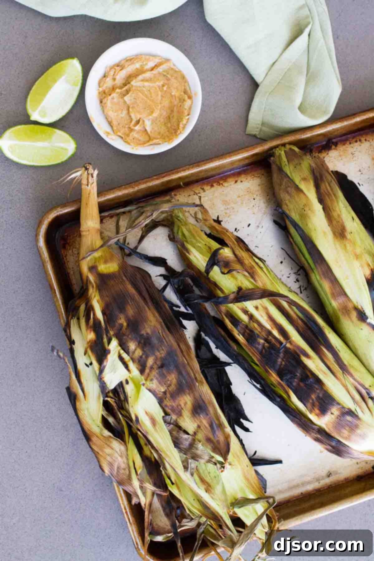 Nothing says summer like grilled corn on the cob! And this Grilled Corn on the Cob with Smoky Butter is so flavorful and the perfect summer side dish. grilled corn with charred husks