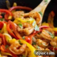 Close up of Shrimp Fajitas with peppers and onions.
