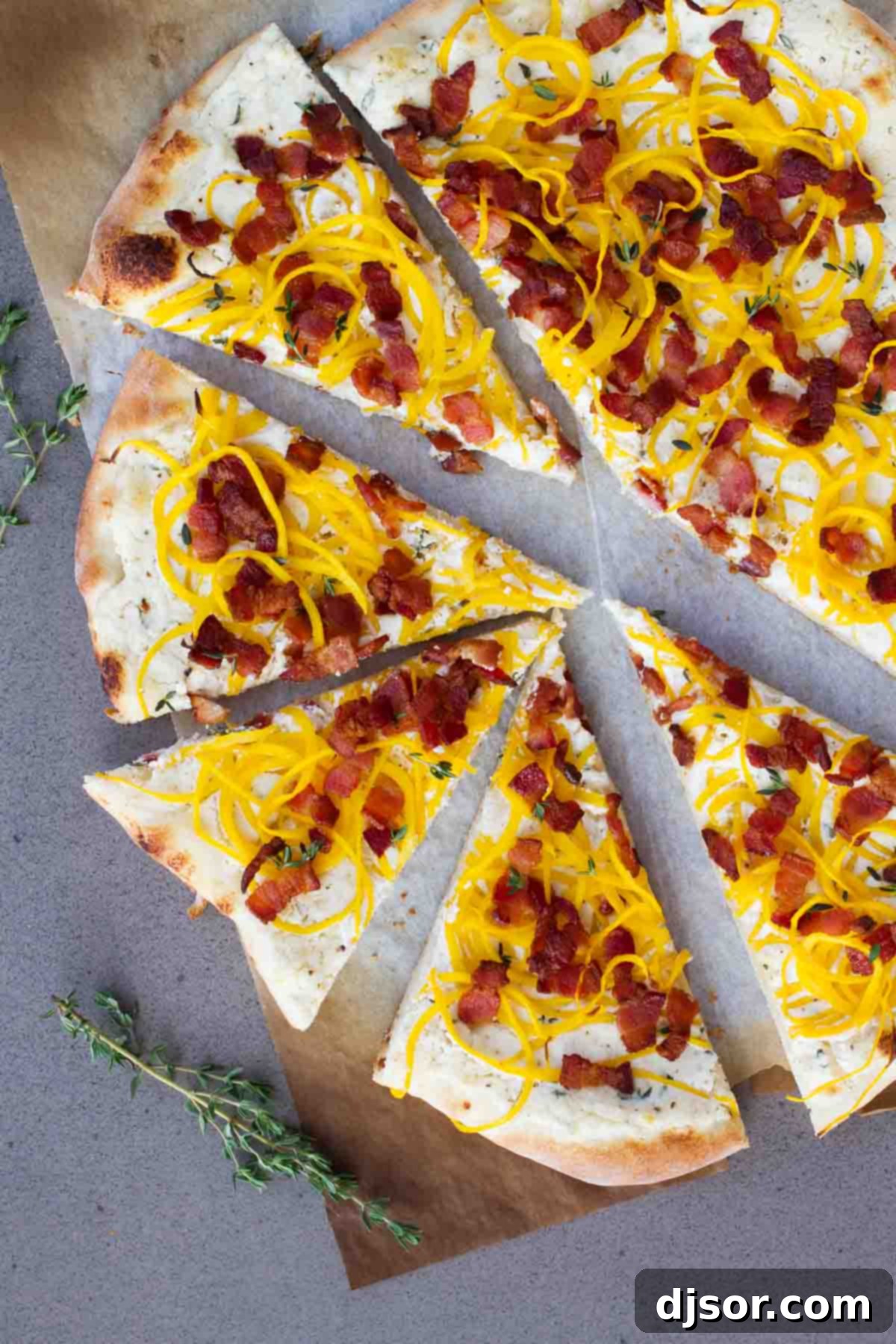 Spiralized Butternut Squash & Bacon Pizza 4 A complete Bacon and Spiralized Butternut Squash Pizza, perfectly baked and sliced, ready to be served.