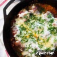 One-Pan Parmesan Meatball Dinner 5 Meatball parmesan skillet topped with cheese and parmesan.