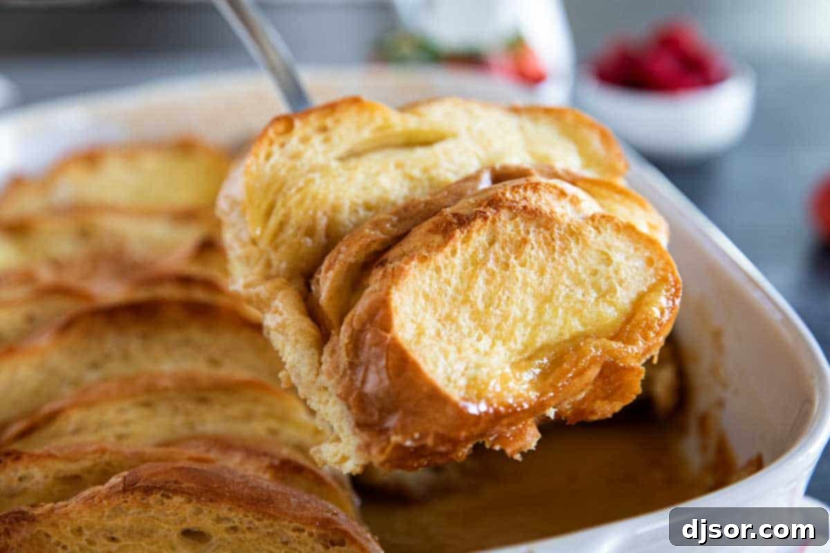 Baked to golden perfection, ready to be scooped: Creme Brulee French Toast. Scooping out Creme Brulee French Toast with spatula.