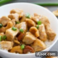 Cashew Chicken made in the Instant Pot in a bowl topped with green onion