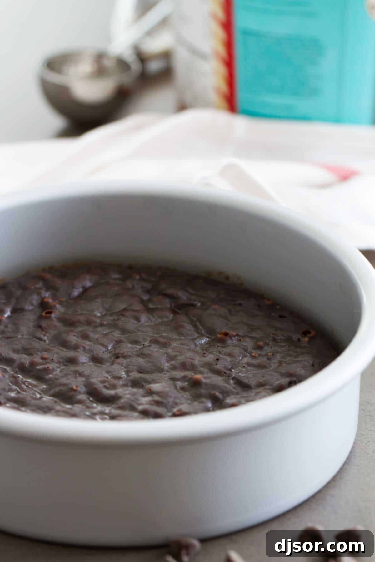 A 7-inch round pan filled with warm, dense pressure cooker fudgy brownies, freshly removed from the Instant Pot.