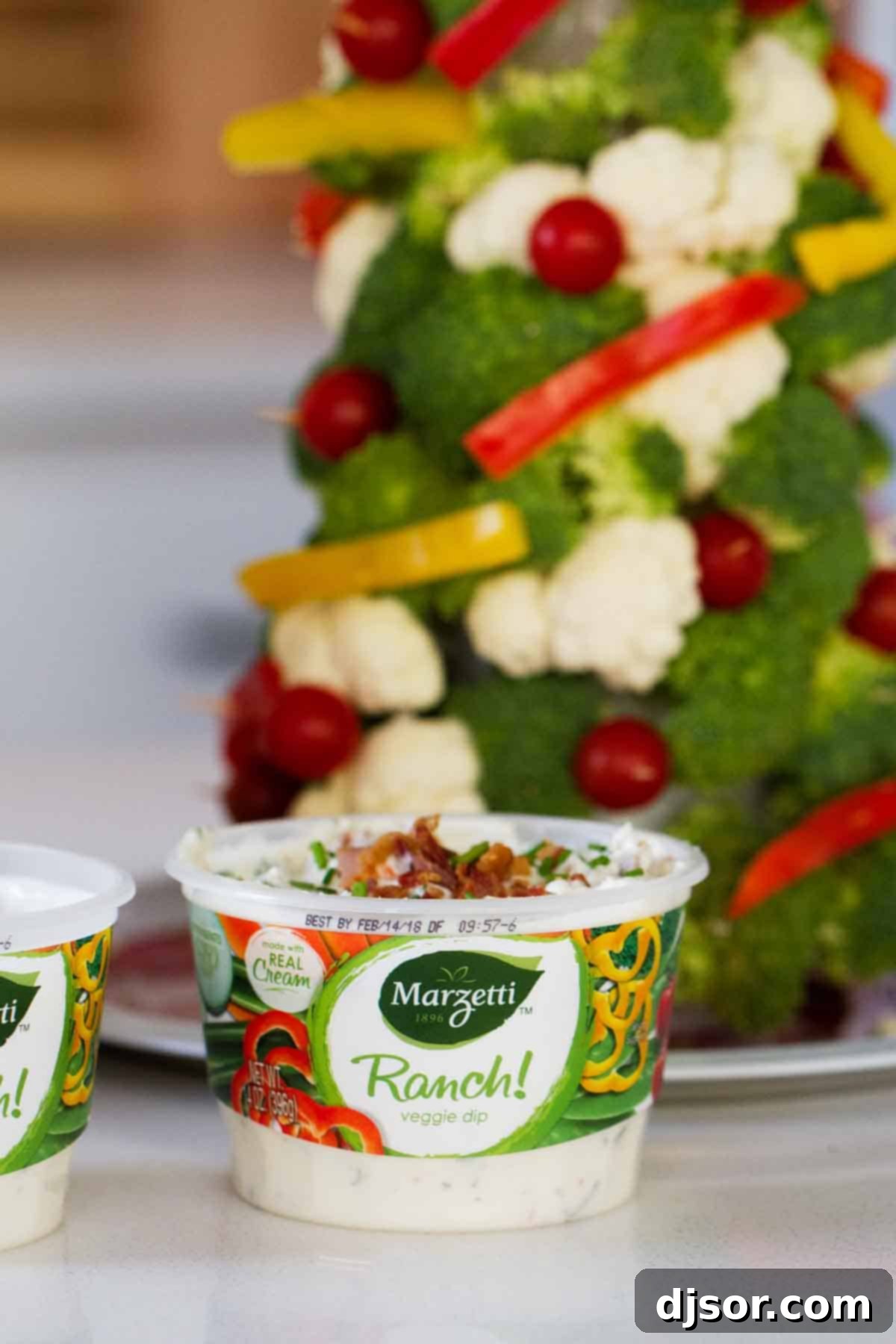Festive Veggie Trees with Savory Bacon Chive Ranch Dip 2 Bacon Chive Ranch Dip in front of a Veggie Christmas Tree, showcasing a delightful and healthy holiday appetizer setup.