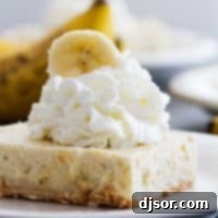 Banana Cheesecake Cookie Bar topped with whipped cream.