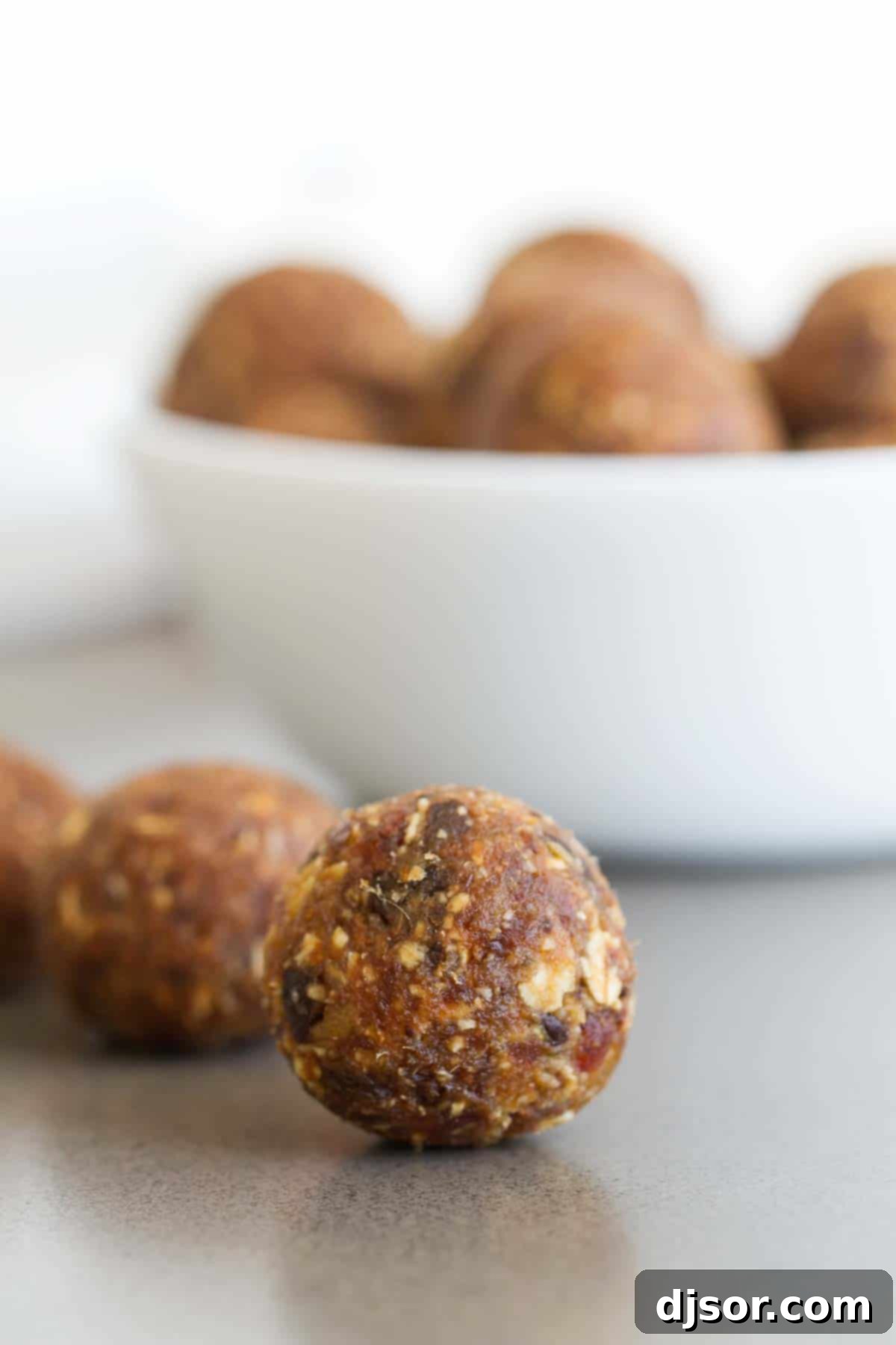 Close-up of healthy Peanut Butter Chocolate Energy Balls arranged neatly.