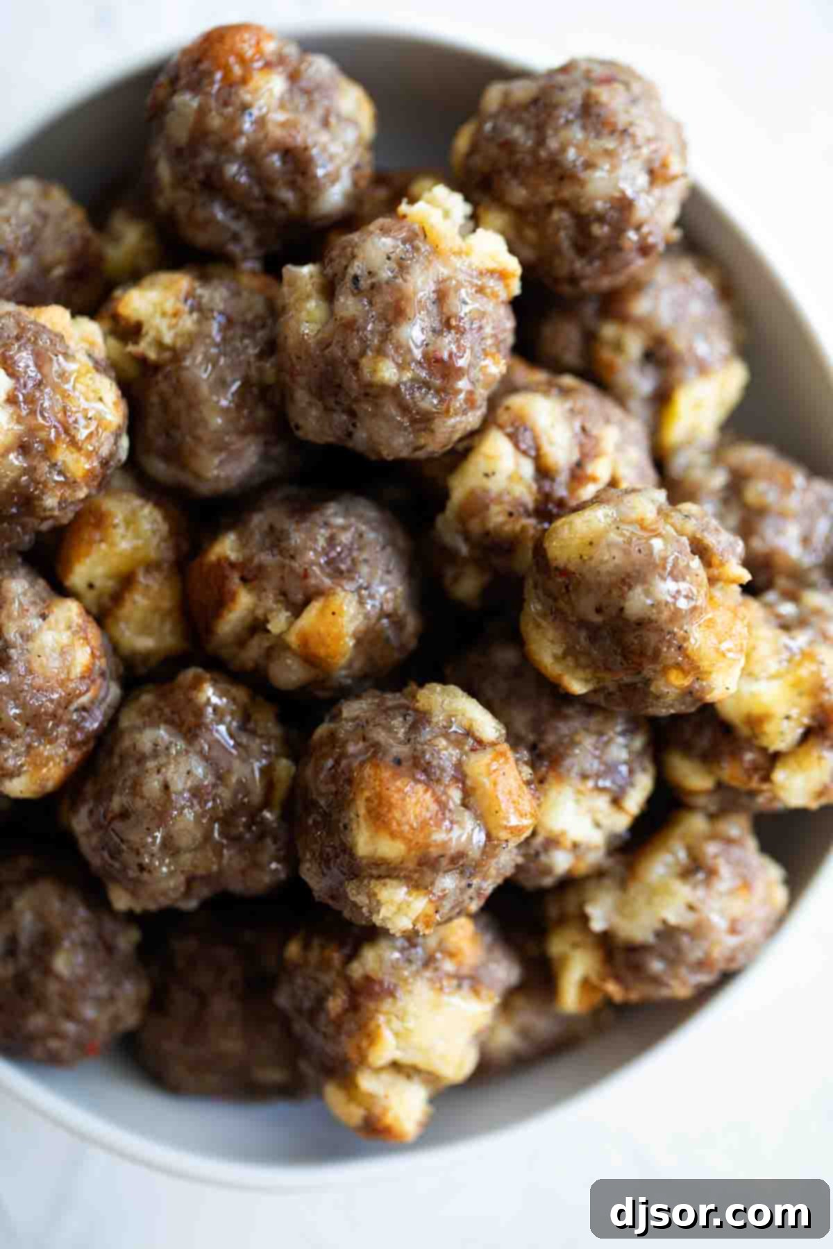 Savory Breakfast Sausage Bites 6 bowl of breakfast sausage meatballs with maple syrup