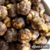 Savory Breakfast Sausage Bites 7 bowl of breakfast sausage meatballs with maple syrup