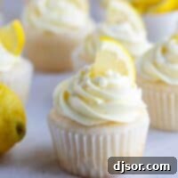 Zesty Lemon Buttercream 2 Lemon Buttercream Frosting on top of cupcake with a lemon slice