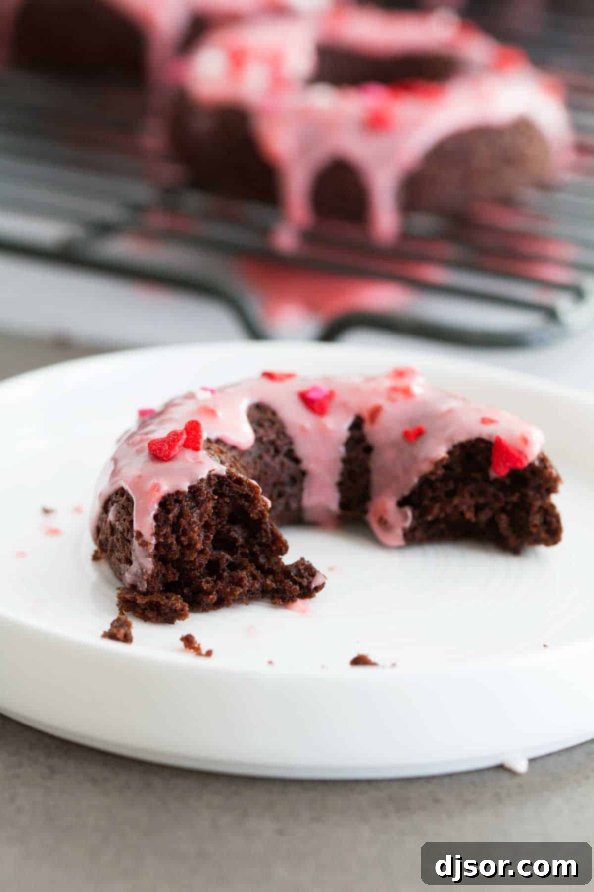 Baked Chocolate Donuts with Cherry Glaze cut donut