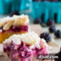 A shortbread base is topped with a creamy blackberry layer and then a streusel top in these Blackberry Pie Bars that you won’t be able to keep your hands out of!