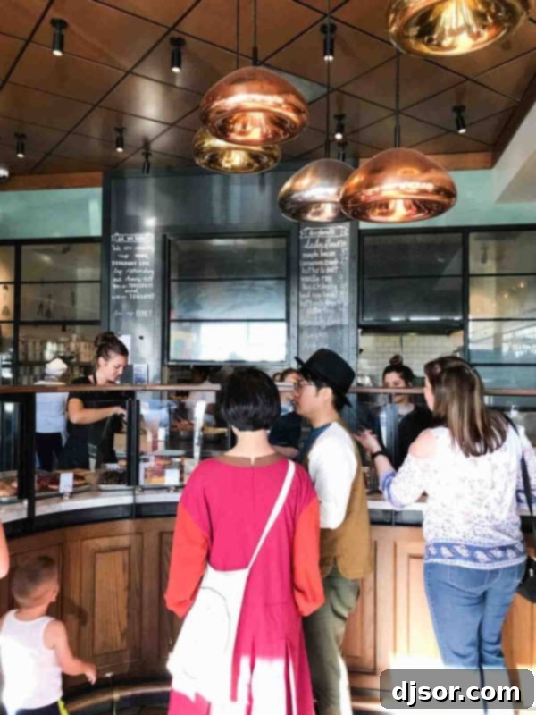 Sidecar Doughnuts in Costa Mesa, California: A True Doughnut Destination A selection of Sidecar Doughnuts presented on a wooden board, showcasing their vibrant colors and textures.