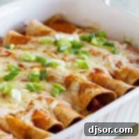 Hearty Sausage and Bean Enchiladas 5 Pan of Sausage and Bean Enchiladas topped with enchilada sauce, cheese, and green onions.