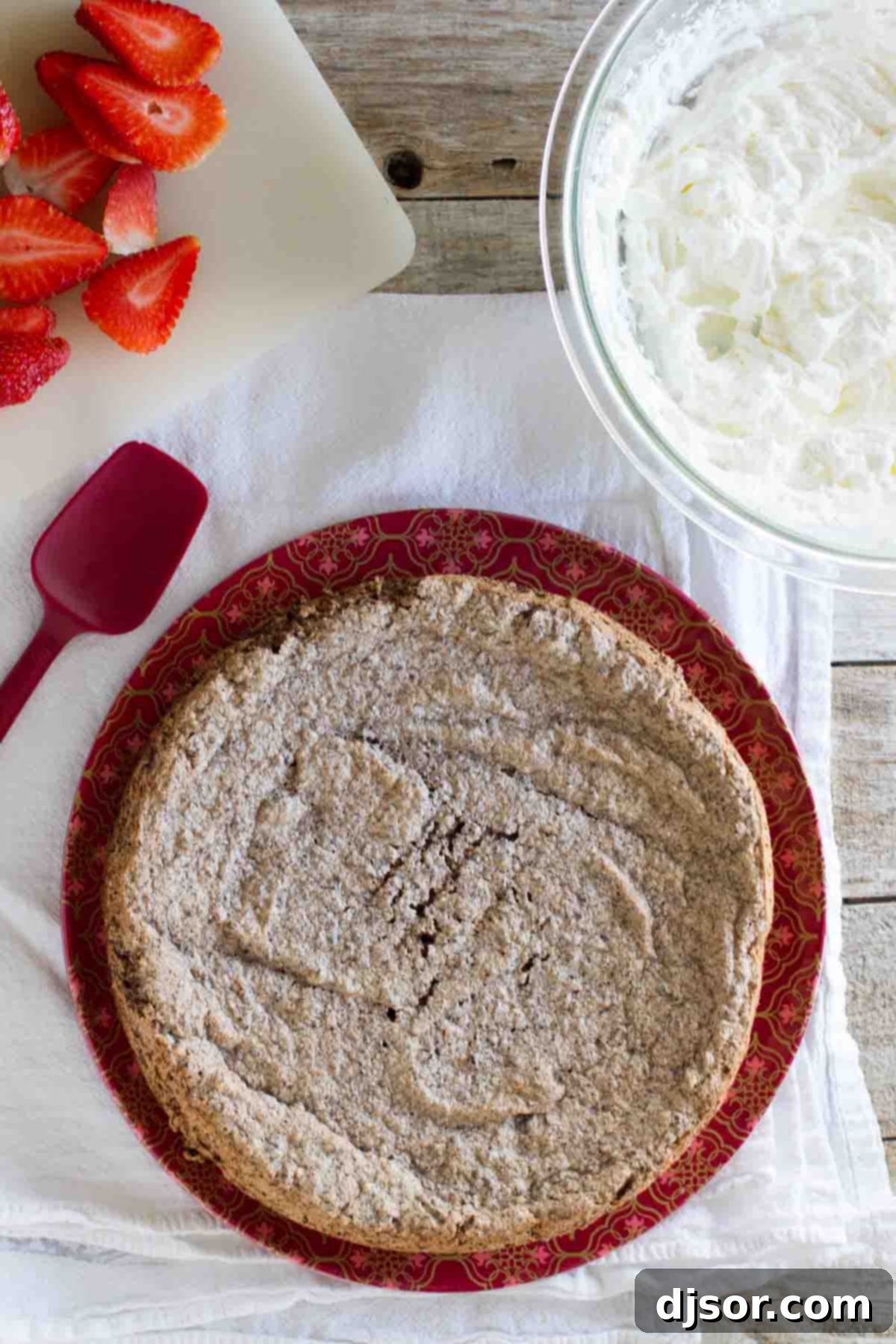 Rustic elegance of the Italian Chocolate Almond Flourless Cake An overhead shot showcasing the entire, beautifully baked Italian Chocolate Almond Flourless Cake, rich and inviting, awaiting its first slice.