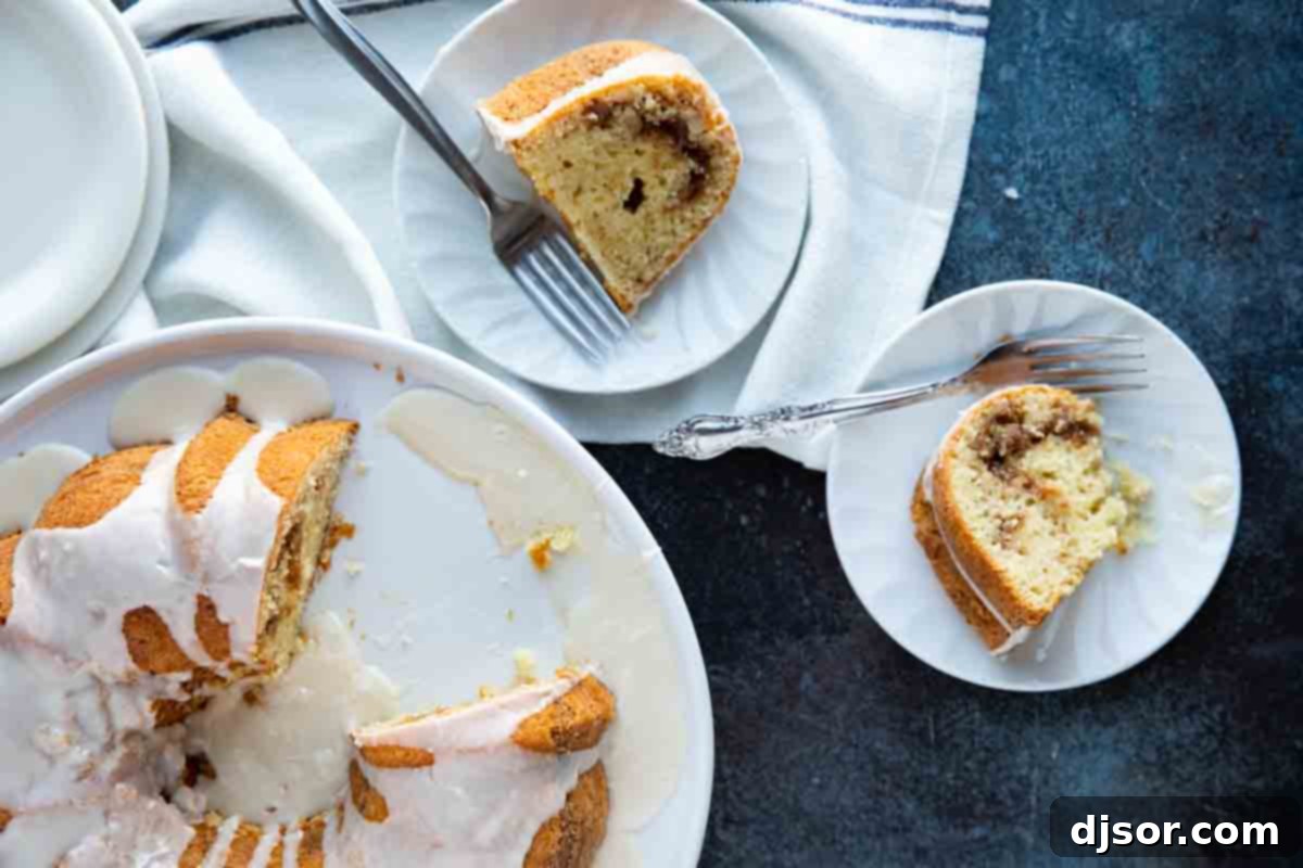 Classic Sour Cream Coffee Cake 10 Two generous slices of sour cream coffee cake served on plates with forks