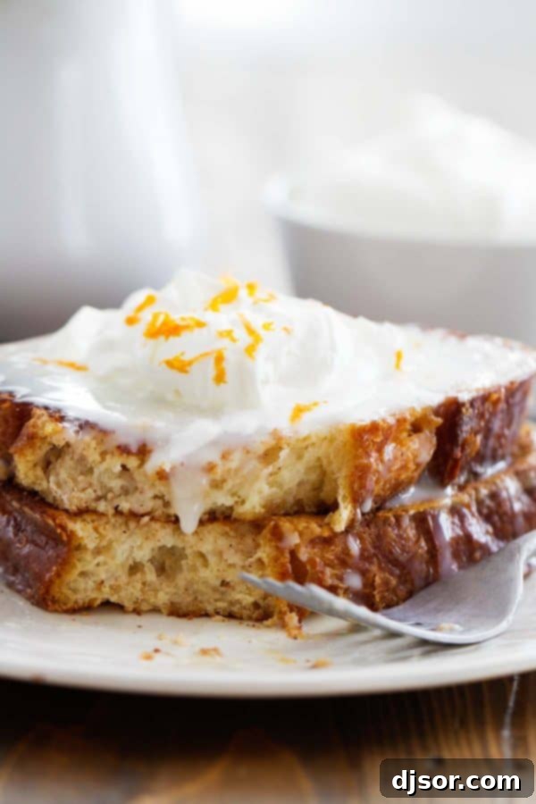The exquisite texture of brioche bread shines in this sweet French Toast, promising a tender and flavorful bite. Close-up of golden-brown sweet French toast, made with slices of rich brioche bread, ready to be served