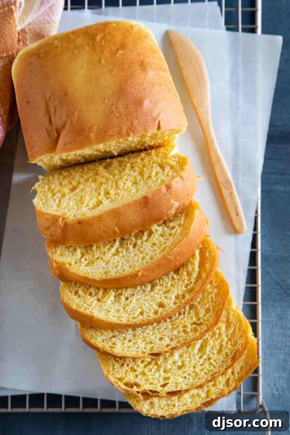 An overhead view of a perfectly sliced loaf of butternut squash bread.