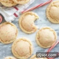 Festive Peppermint Snickerdoodles 10 Peppermint snickerdoodles with a bite taken from one.