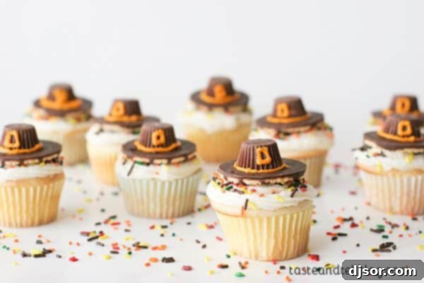 Crafting Your Perfect Thanksgiving 11 Adorable Pilgrim Hat Thanksgiving Cupcakes, decorated with classic buttercream frosting and edible pilgrim hats, arranged on a festive serving tray.