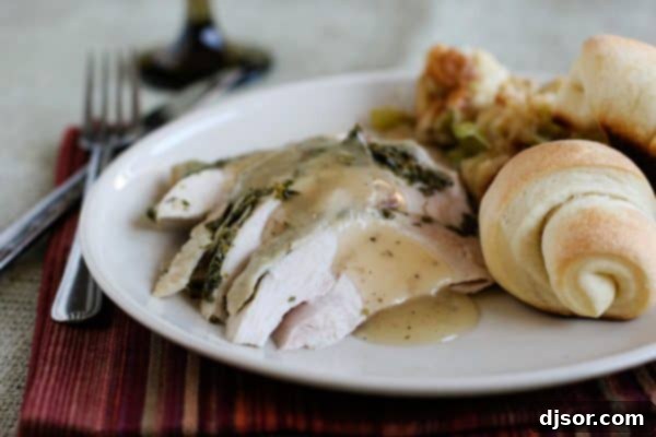 Crafting Your Perfect Thanksgiving 2 Succulent herb-roasted turkey breast, sliced and drizzled with rich gravy, ready to be served on a platter.