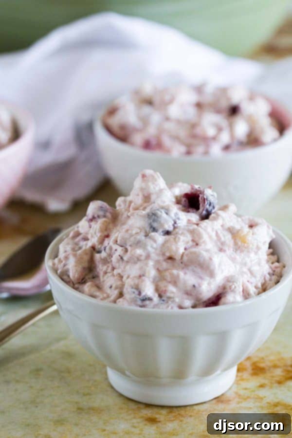 Crafting Your Perfect Thanksgiving 7 A colorful Cranberry Salad in a serving bowl, showcasing its vibrant red hue and chunky texture, perfect for a holiday side.