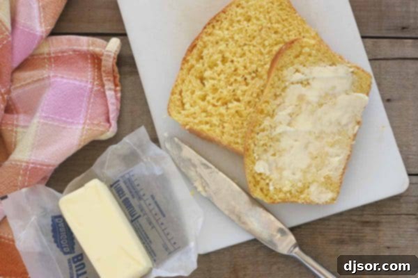 Crafting Your Perfect Thanksgiving 9 Thick slices of warm butternut squash bread, lightly toasted and spread with butter, presented on a cutting board.