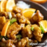 bowl of homemade orange chicken with green onions