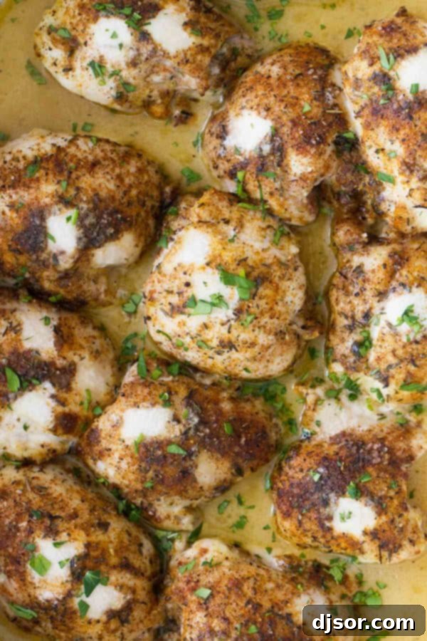 Easy Lime Baked Chicken Thighs arranged in a ceramic baking dish.