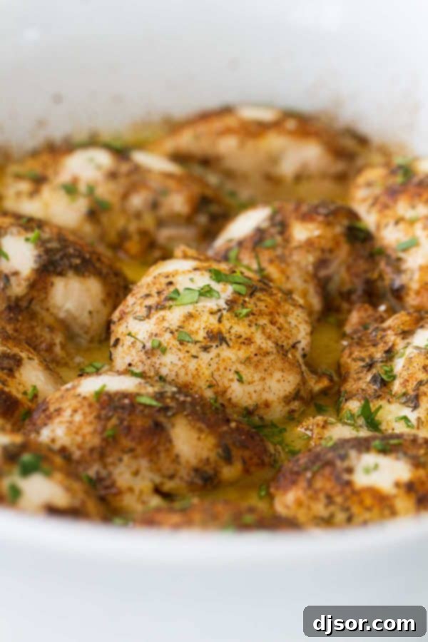 Baked lime chicken thighs resting in the pan, ready to be served.