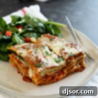 Baked Zucchini Parmesan 9 Slice of Zucchini Parmesan on a plate with a salad.